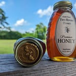 One classic jar of honey with wax seal showing